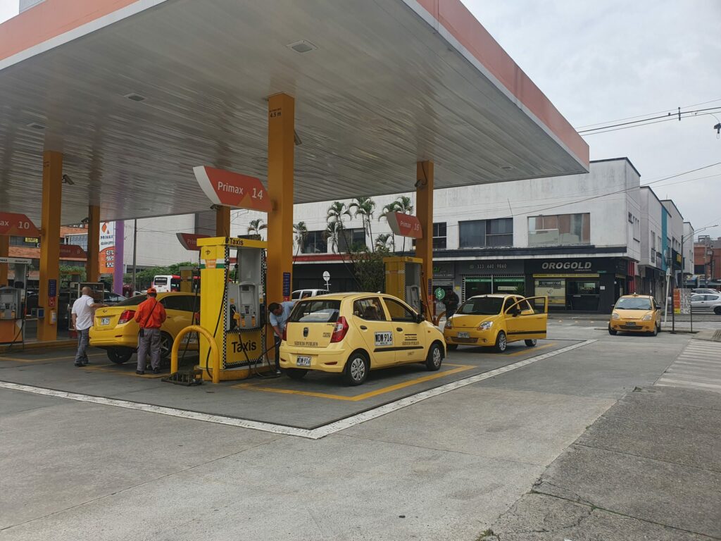 Gas station with taxis getting refueled