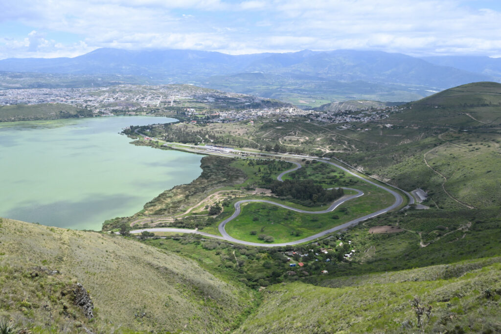 picture from the hill. streets and race track in front, lake to the left