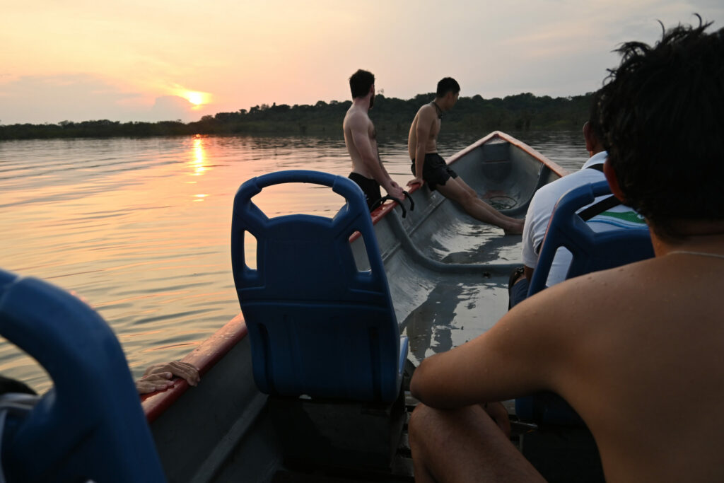 People on a boat during sunset